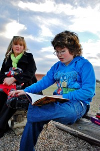 Cheryl Whitehouse (left) sits with her son, Casey (right), as he reads the Tales of Beedle the Bard. 